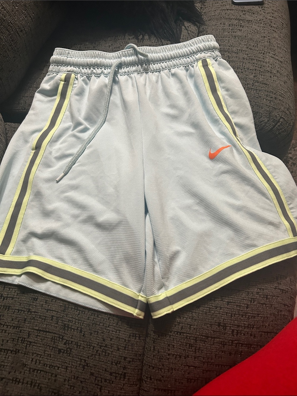 Nike Light Blue Mesh Shorts with Neon Yellow Trim and Orange Swoosh